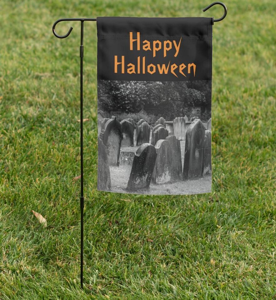 black garden flag with tombstones and orange Happy Halloween text